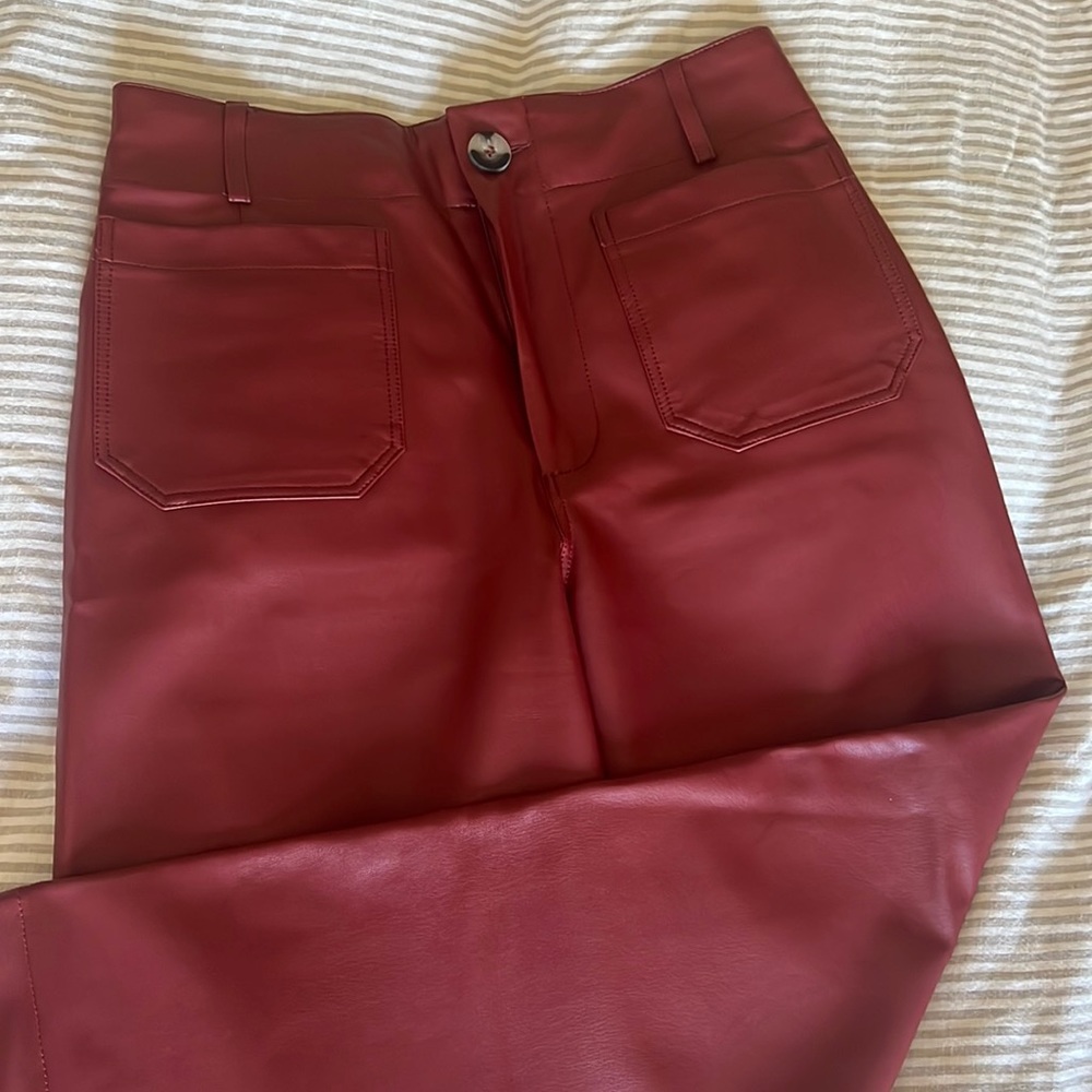 The Colette burgundy faux Leather pant with flared ankle. An Anthro staple.